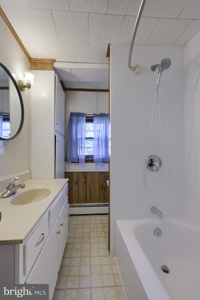 bathroom with shower / bath combination, a baseboard radiator, vanity, and crown molding