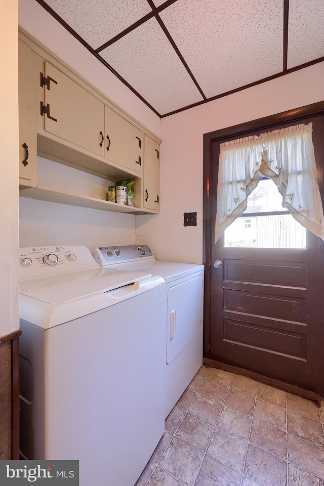 laundry area featuring cabinets and independent washer and dryer