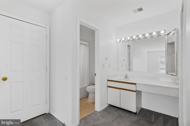 full bathroom with shower / tub combo, toilet, and vanity