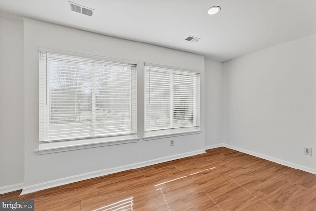 empty room featuring wood-type flooring