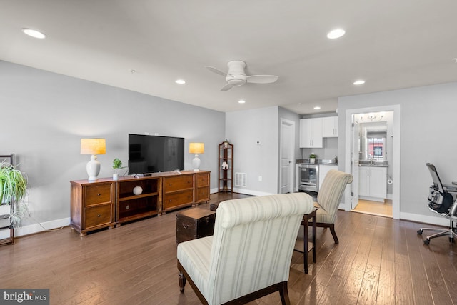 living room featuring dark wood finished floors, wine cooler, and recessed lighting