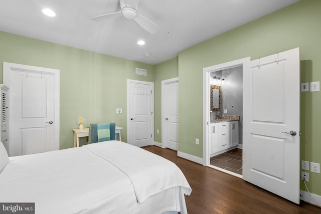 bedroom featuring baseboards, visible vents, recessed lighting, dark wood-style flooring, and connected bathroom