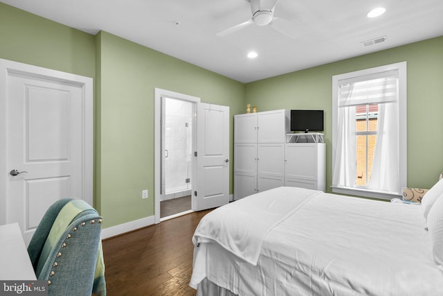 bedroom with baseboards, visible vents, dark wood finished floors, recessed lighting, and connected bathroom