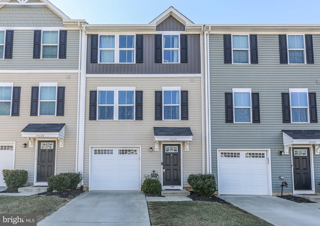 multi unit property featuring a garage