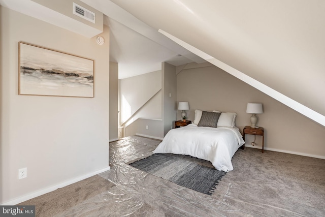 bedroom with carpet flooring and vaulted ceiling