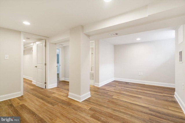 basement featuring hardwood / wood-style flooring