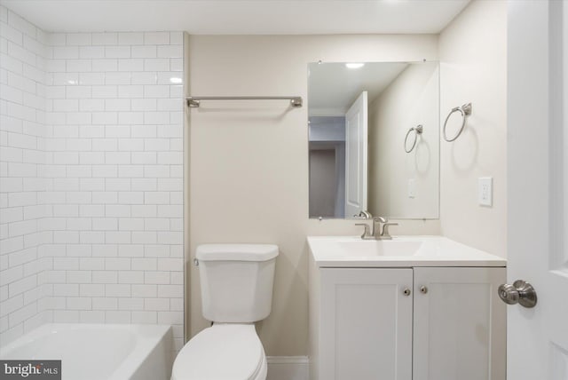 full bathroom with toilet, vanity, and tiled shower / bath