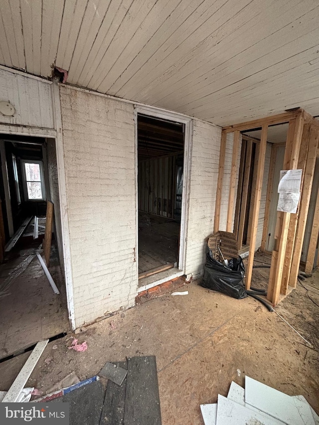 miscellaneous room with brick wall