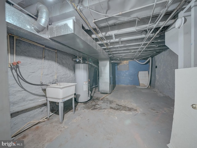 unfinished basement featuring water heater, a sink, and heating unit