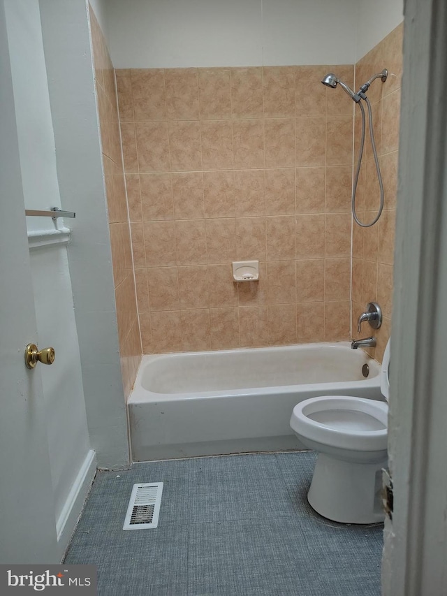 bathroom featuring toilet, shower / bath combination, tile patterned flooring, and visible vents