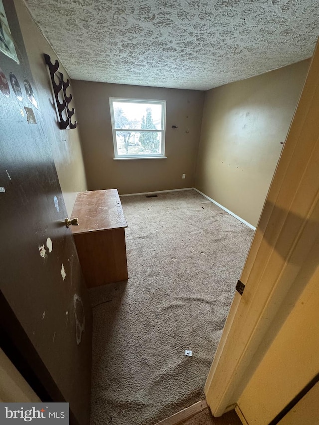 interior space featuring a textured ceiling