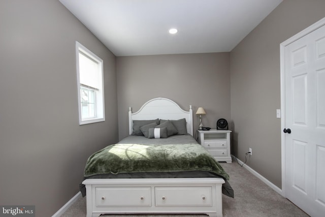 bedroom featuring light carpet