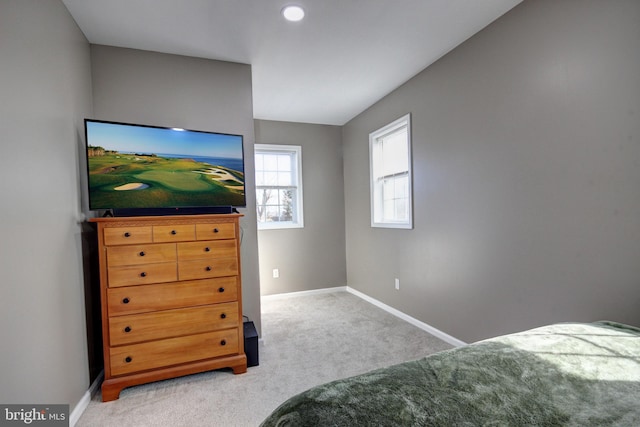 bedroom featuring light colored carpet