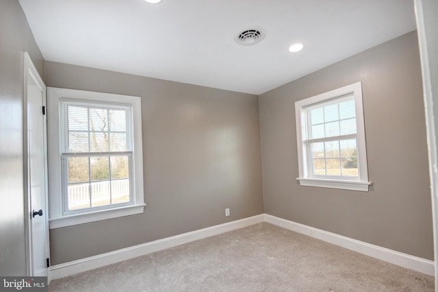 empty room with light colored carpet