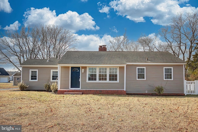 ranch-style home with a front yard