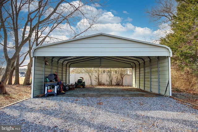 view of parking / parking lot featuring a carport