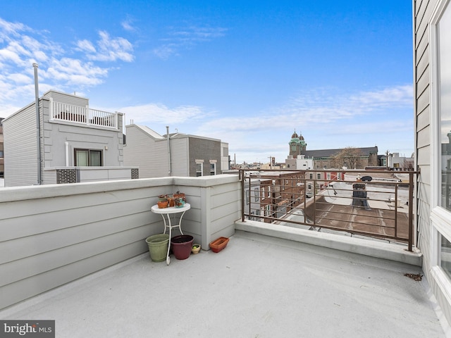 view of patio featuring a balcony