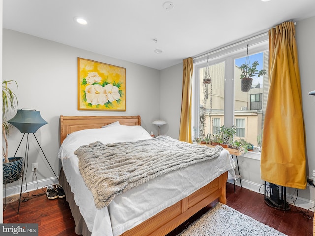 bedroom featuring dark wood-type flooring