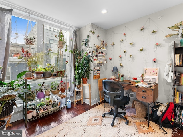 home office featuring dark wood-type flooring and plenty of natural light