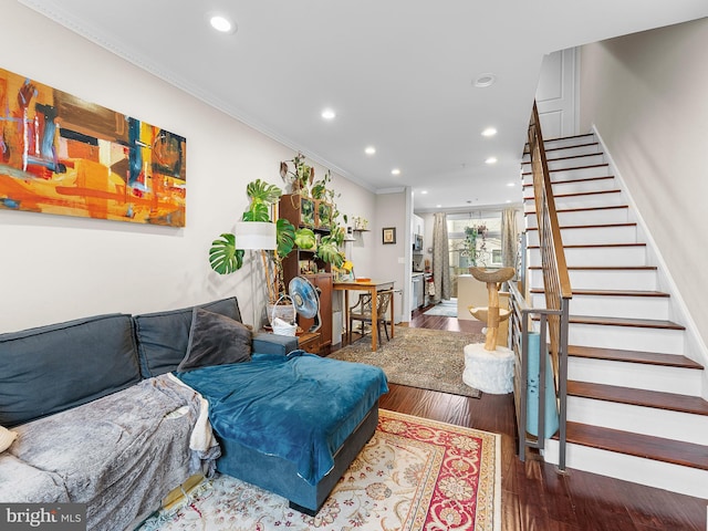 living room with hardwood / wood-style floors and ornamental molding