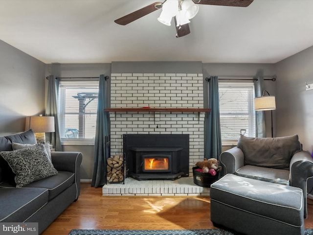 living room featuring ceiling fan and wood finished floors