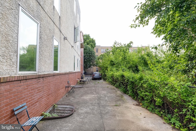 view of property exterior featuring a patio area