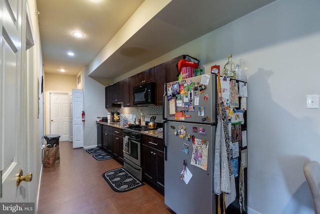 kitchen featuring tasteful backsplash, stainless steel appliances, and dark brown cabinets