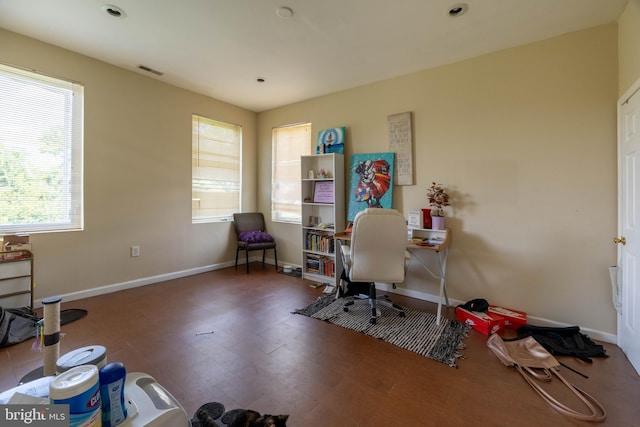 office with dark hardwood / wood-style flooring