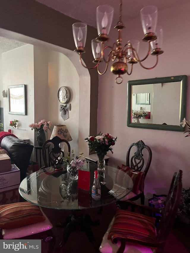 dining room featuring a notable chandelier