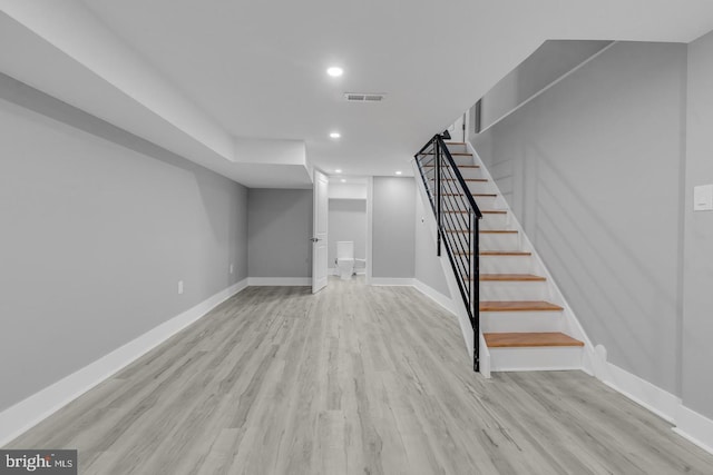 basement featuring light wood-type flooring