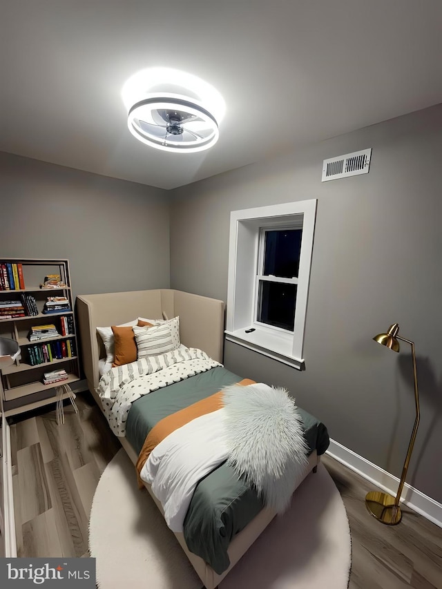 bedroom featuring dark hardwood / wood-style floors