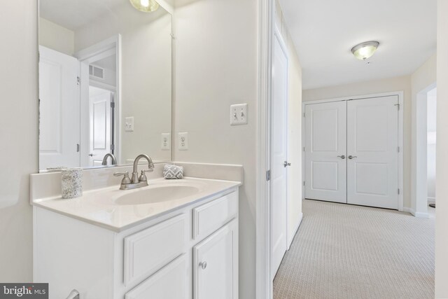 bathroom featuring visible vents and vanity