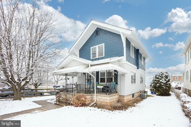 view of front of property with central AC and a porch