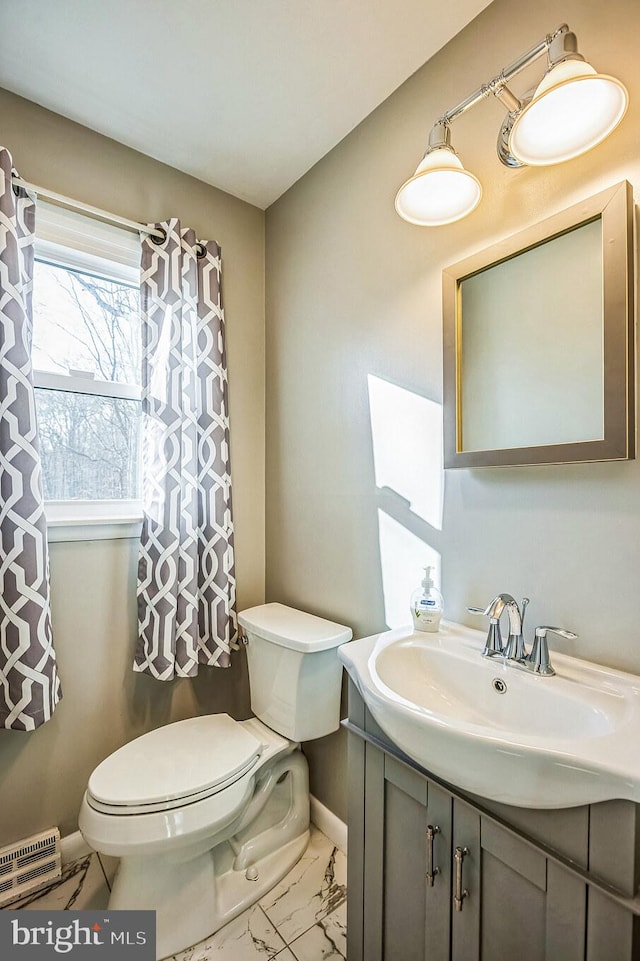 bathroom with vanity and toilet