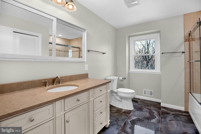 full bathroom featuring enclosed tub / shower combo, vanity, and toilet