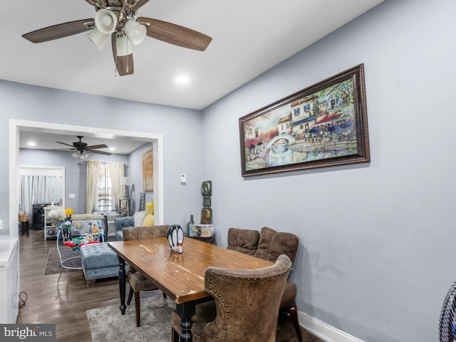 dining space with recessed lighting, baseboards, and wood finished floors