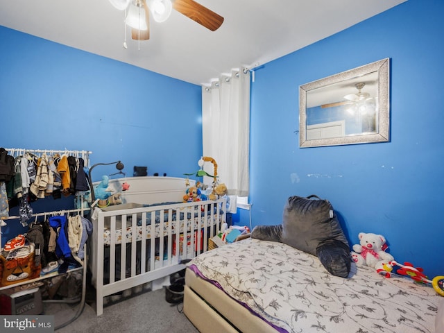 carpeted bedroom featuring ceiling fan