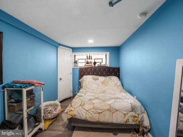 bedroom with wood finished floors