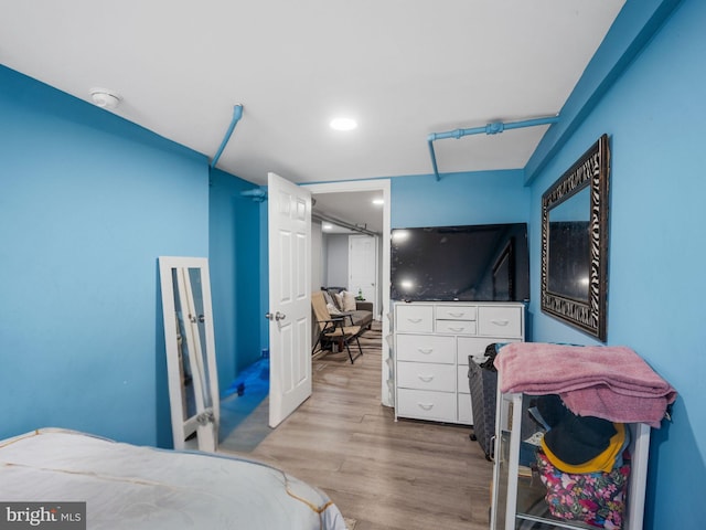 bedroom featuring wood finished floors