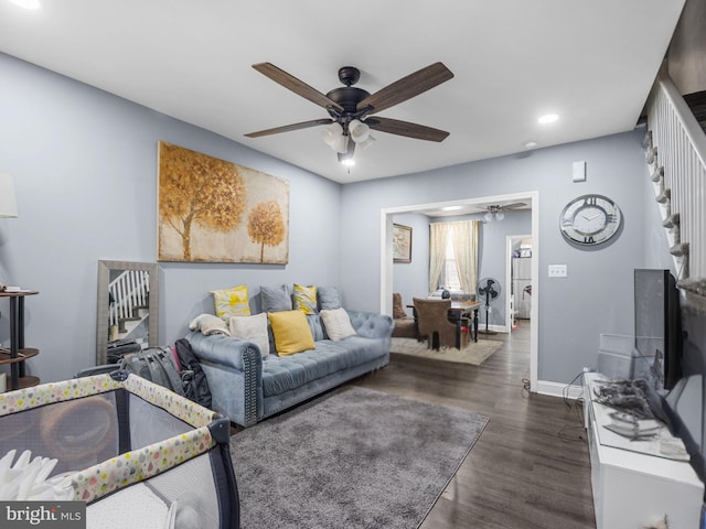 living area with dark wood-style floors, recessed lighting, stairway, baseboards, and ceiling fan