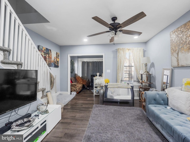 living room featuring stairway, recessed lighting, ceiling fan, and dark wood-style flooring