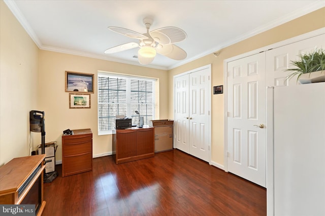 home office with ornamental molding, dark wood-type flooring, and ceiling fan