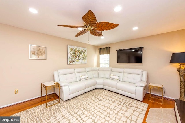 living room with a ceiling fan, recessed lighting, and wood finished floors