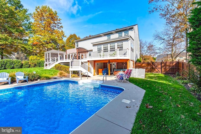 back of house featuring stairs, a yard, a fenced backyard, and a wooden deck