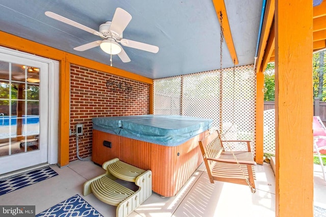 sunroom with a jacuzzi