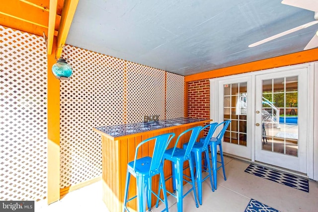 bar with french doors and a bar