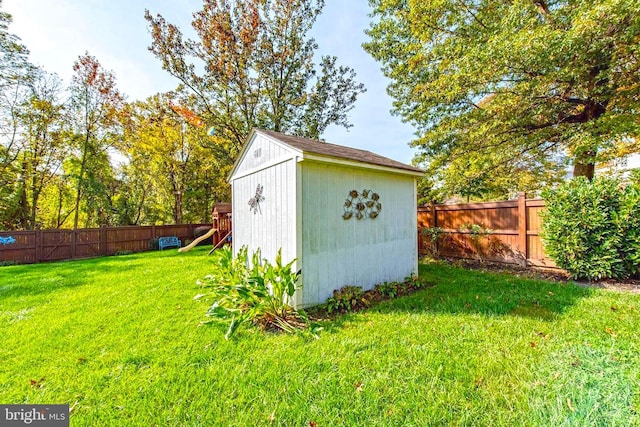 view of shed with a fenced backyard