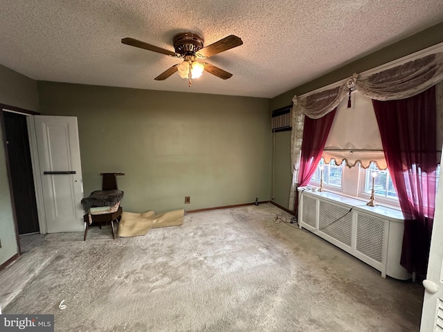 unfurnished bedroom featuring ceiling fan, radiator, and a textured ceiling