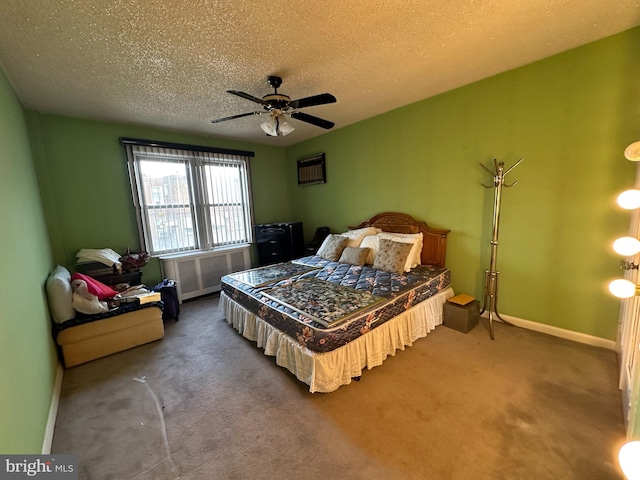 bedroom with carpet floors, ceiling fan, radiator heating unit, and a textured ceiling