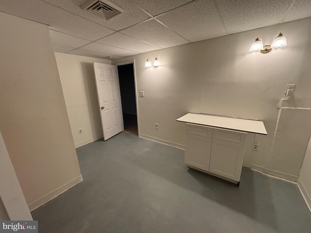 basement with a drop ceiling